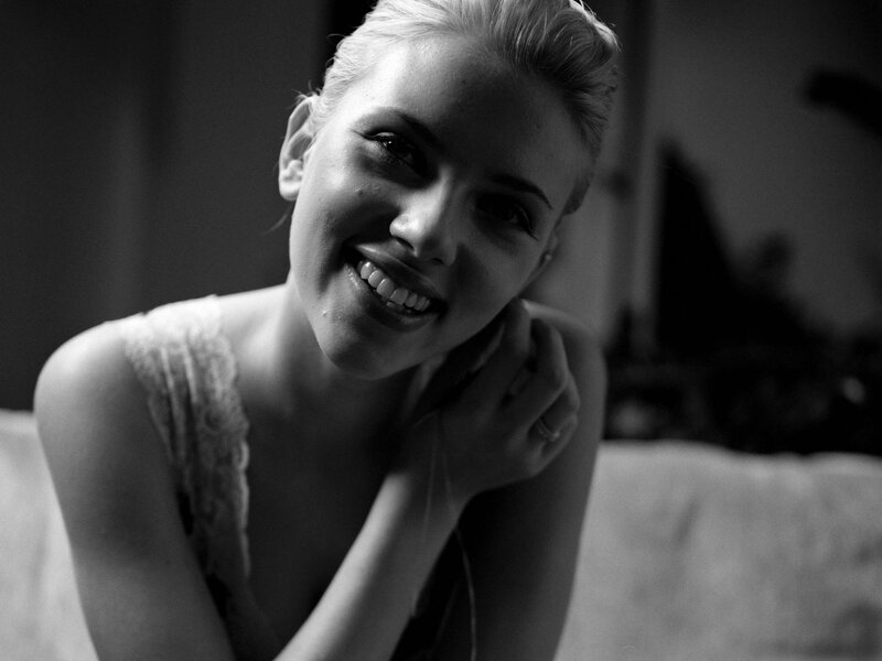 Woman Smiling on Couch — Black