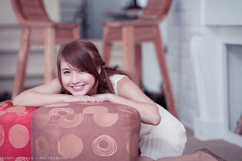 woman smiling on cushion