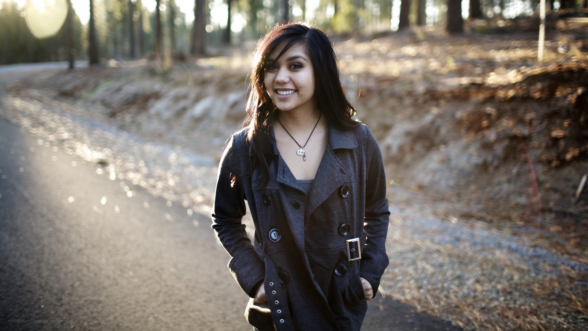 woman smiling on forest path