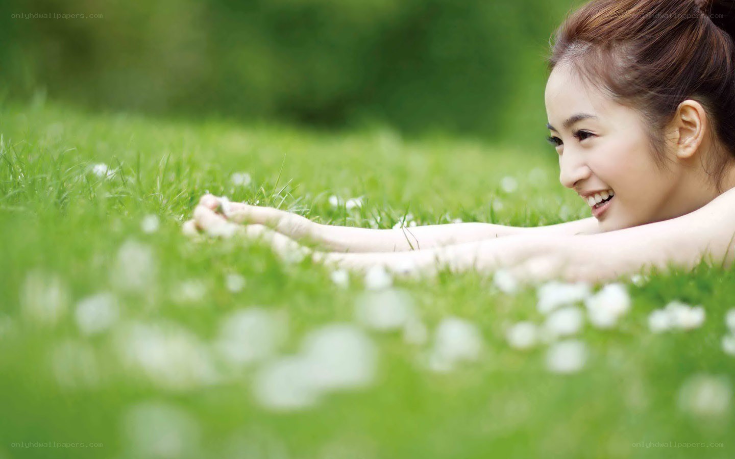 woman smiling on grass