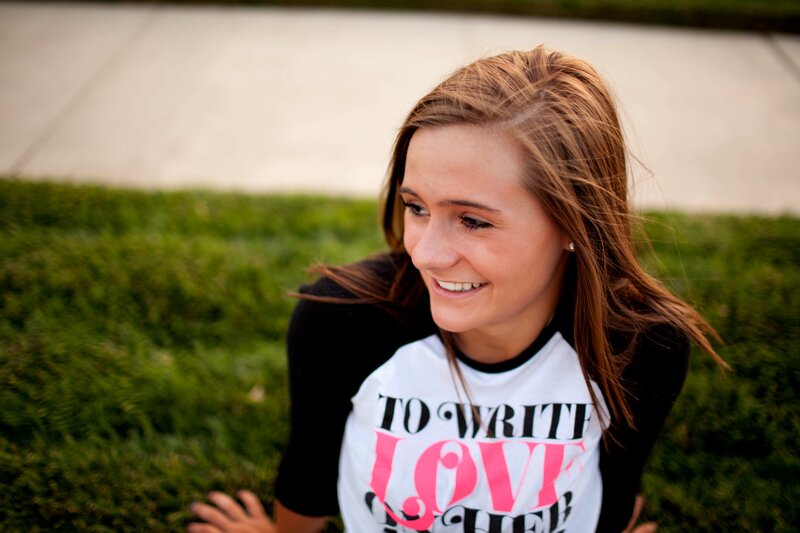 woman smiling on grass