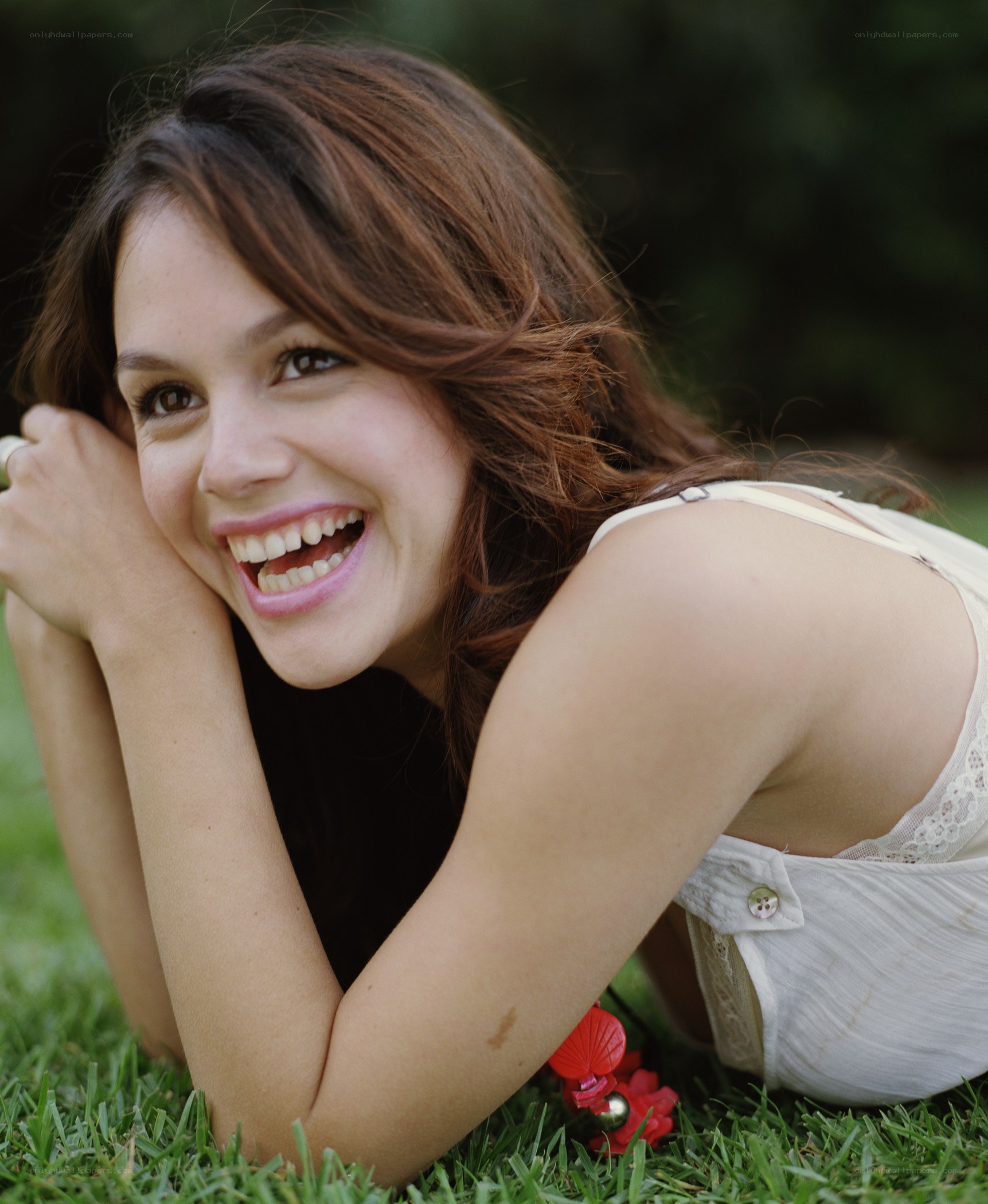 woman smiling on grass