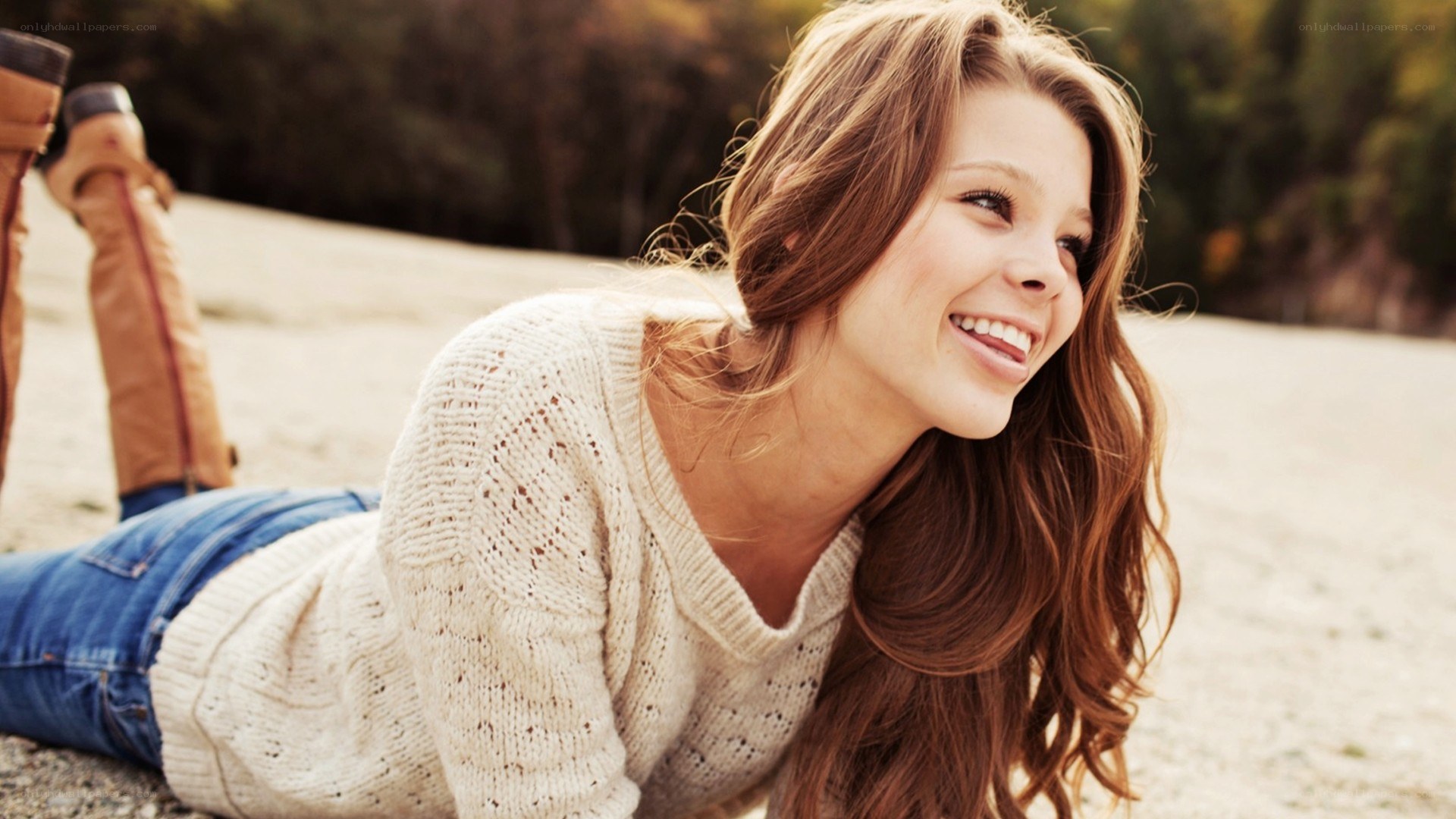 woman smiling on ground