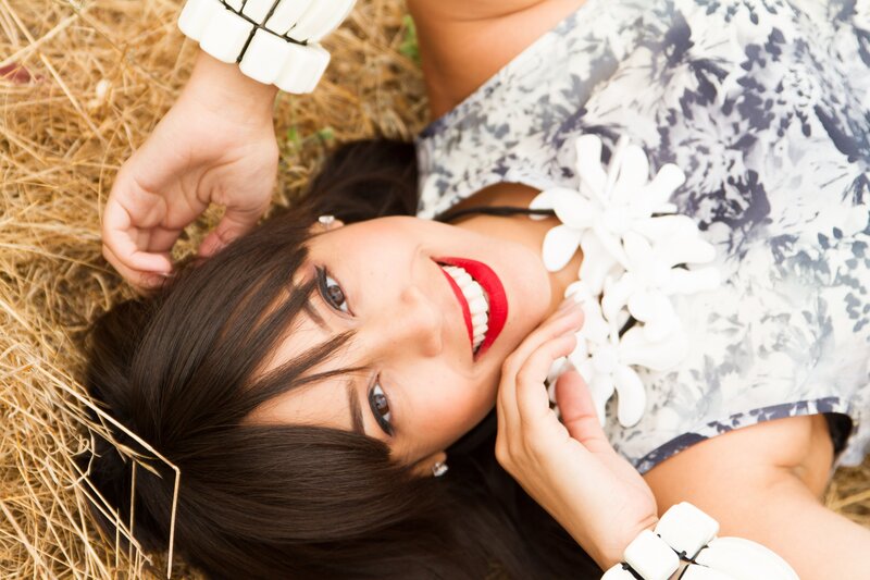 woman smiling on hay
