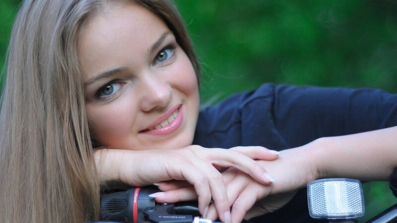 woman smiling on motorcycle