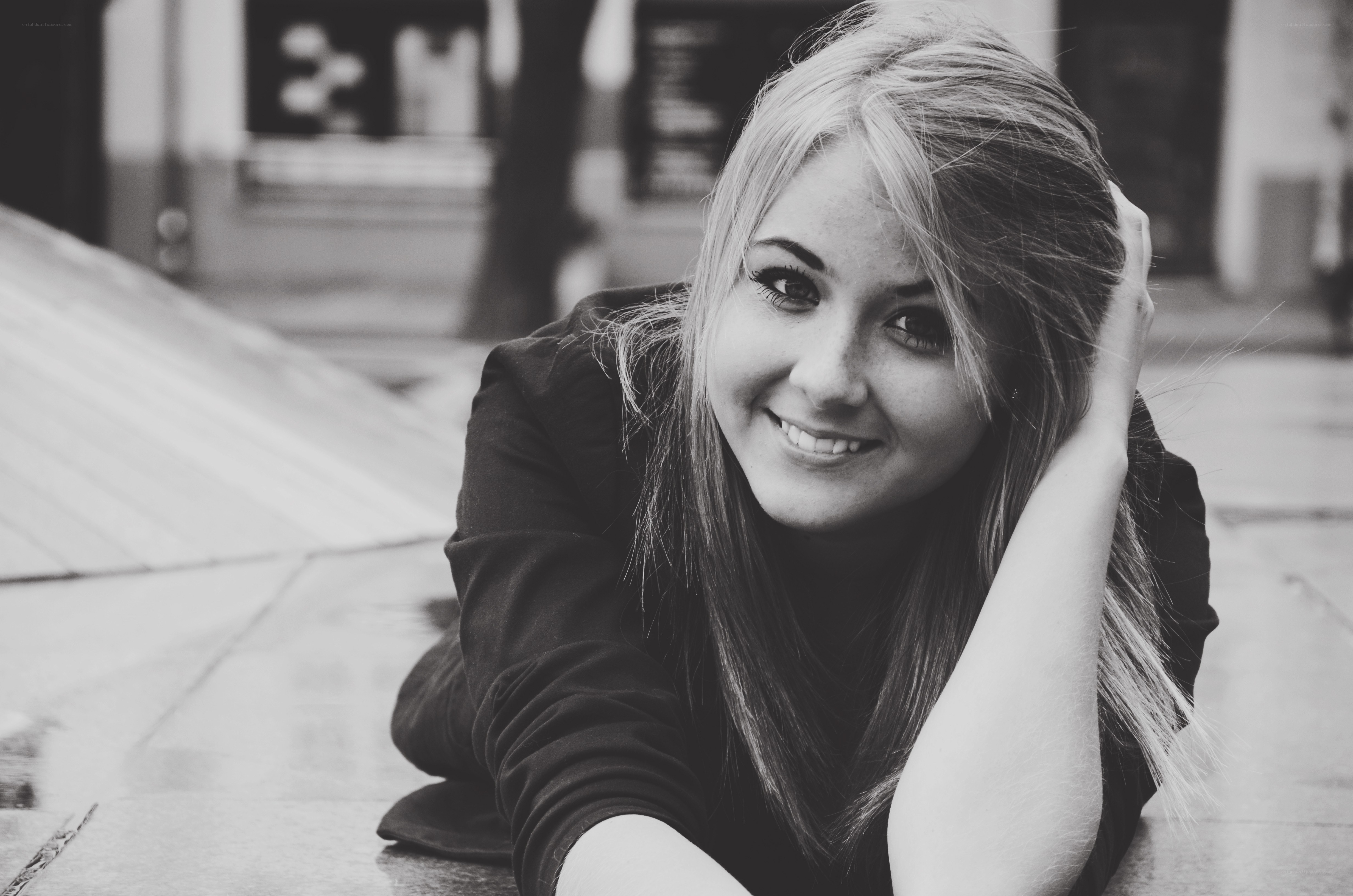 woman smiling on pavement