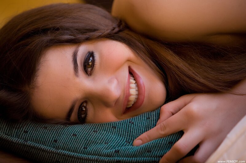 woman smiling on pillow