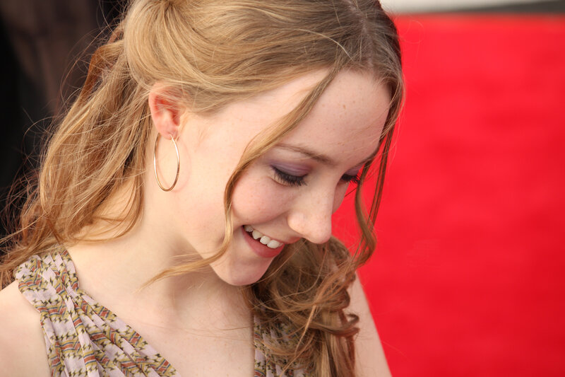 woman smiling on red carpet
