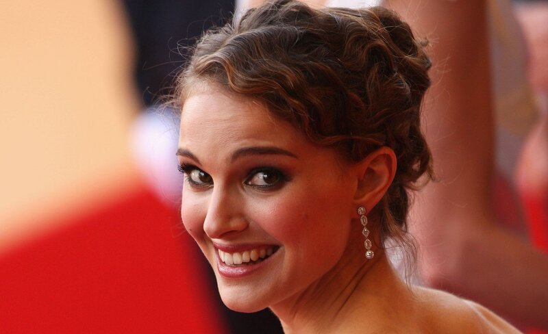 woman smiling on red carpet