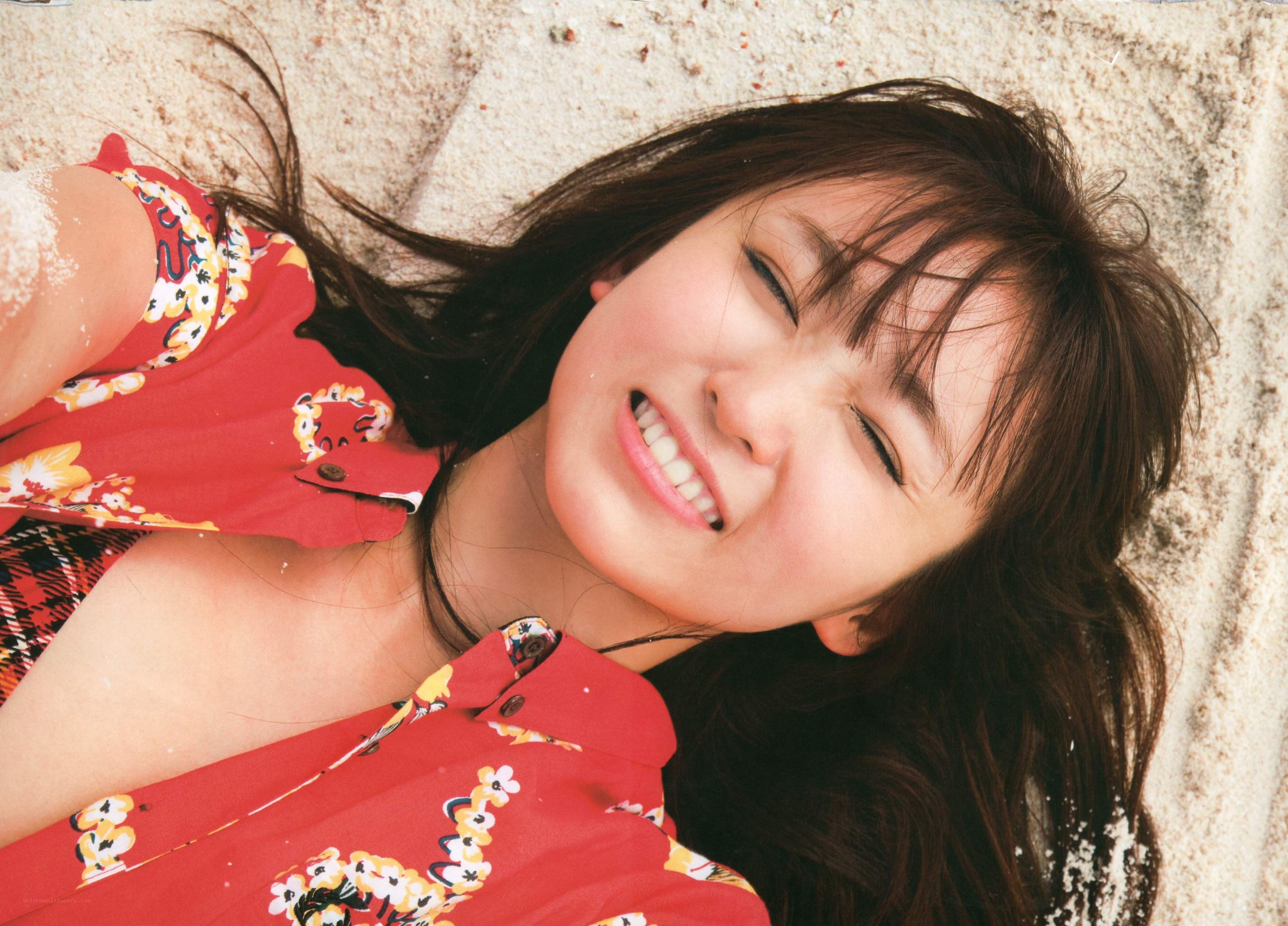 woman smiling on sand