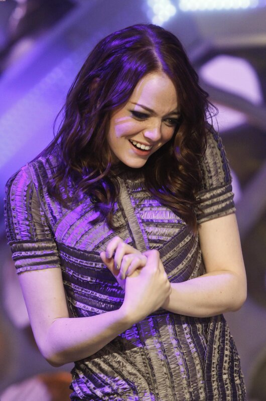 woman smiling on stage