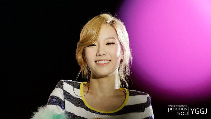 woman smiling on stage