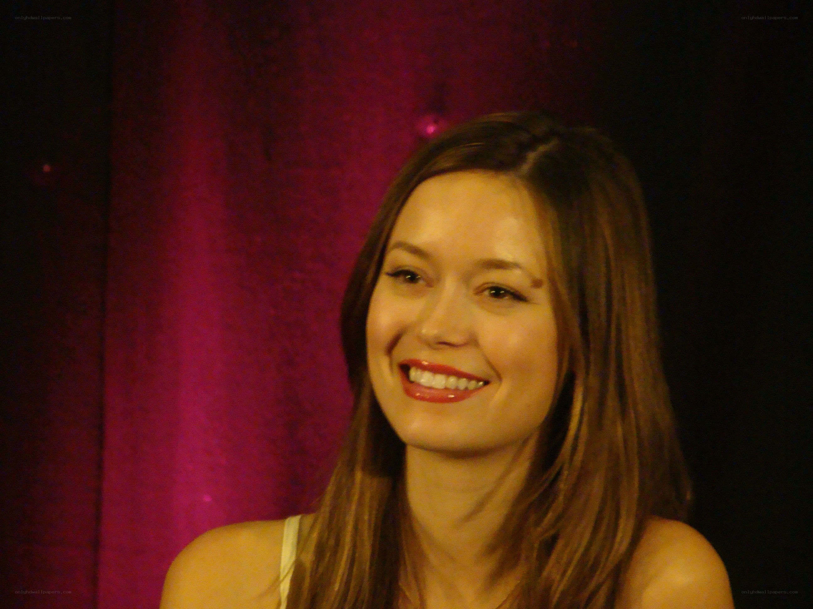 woman smiling on stage