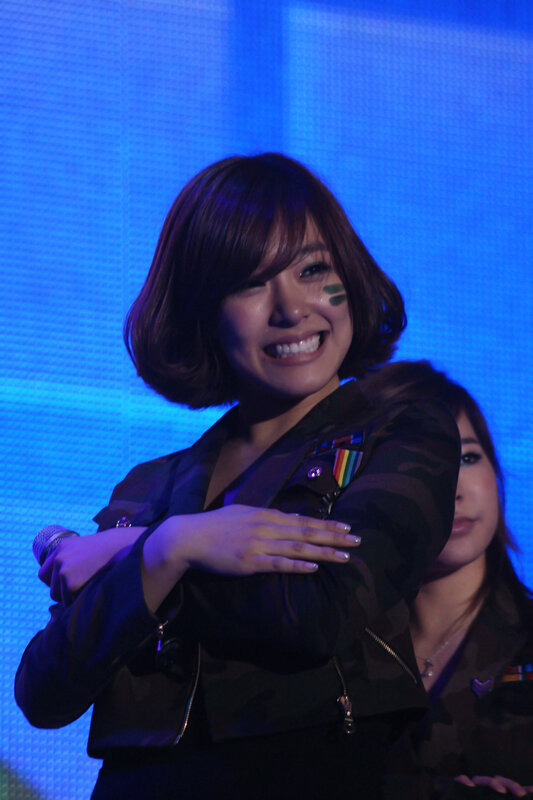 woman smiling on stage