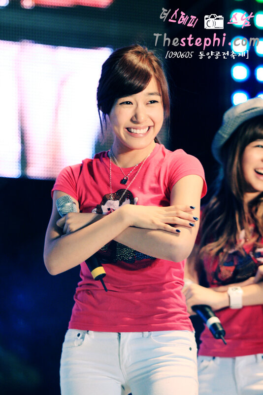 woman smiling on stage