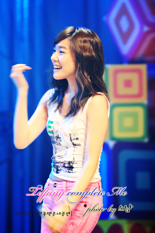 woman smiling on stage