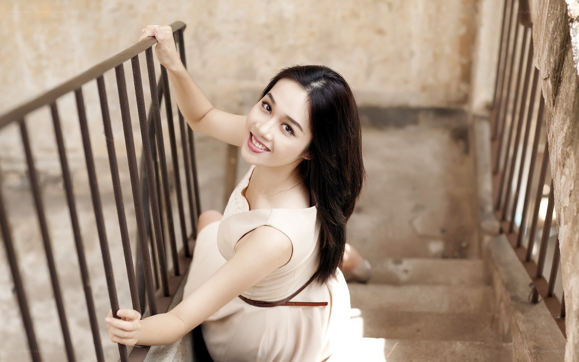 woman smiling on staircase
