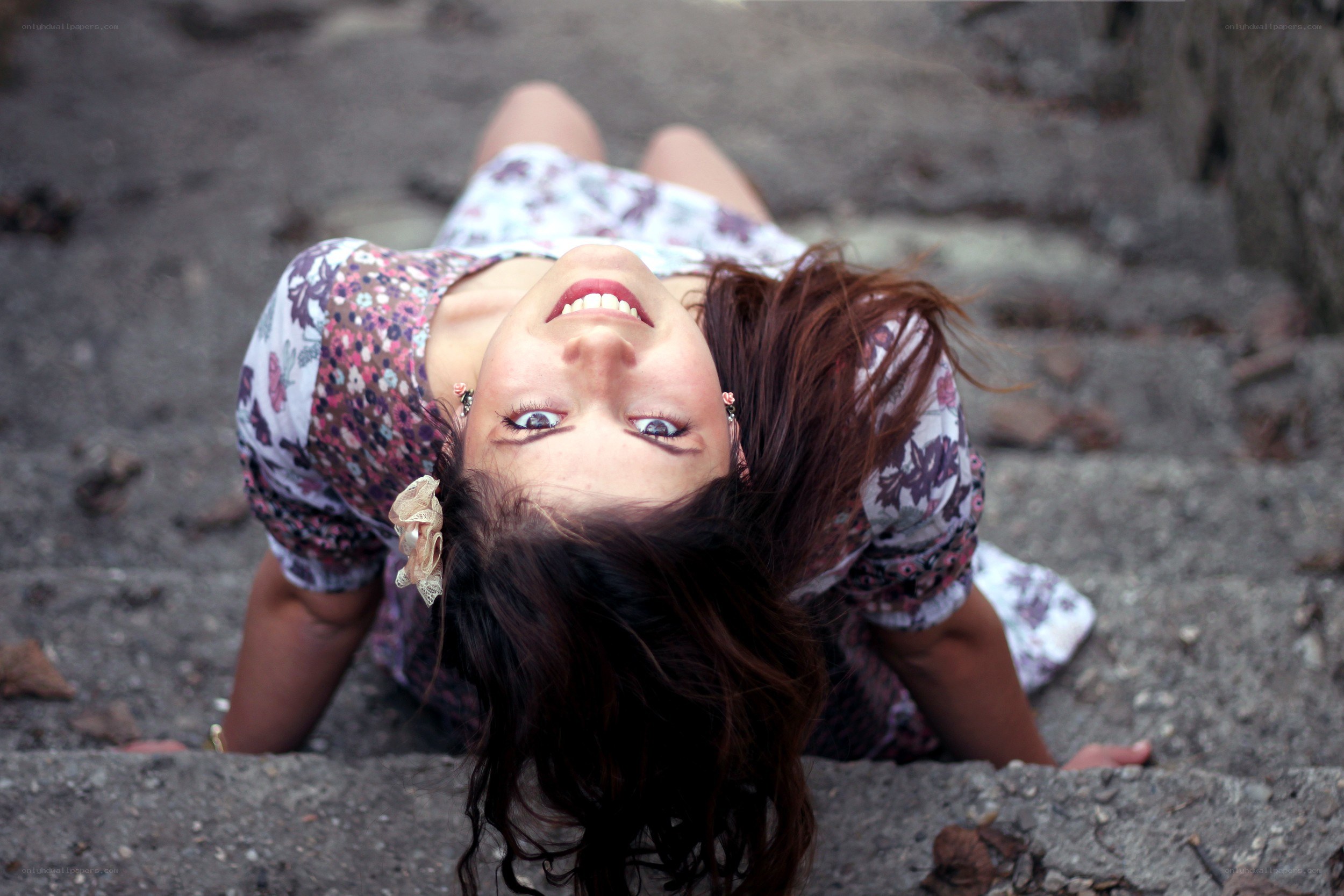 woman smiling on steps