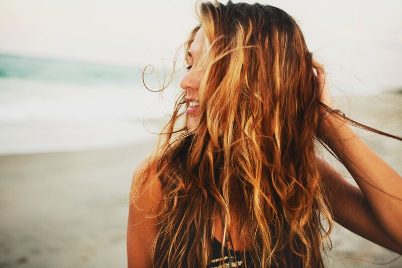 woman smiling on the beach