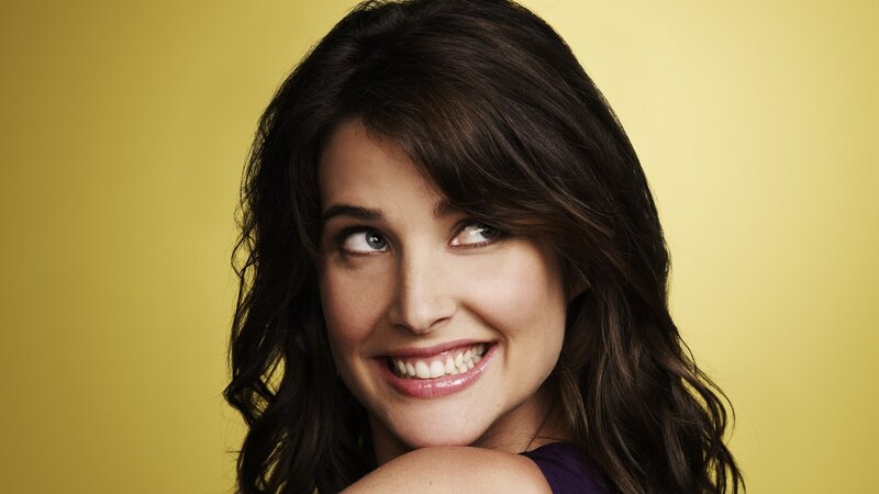 woman smiling on yellow background
