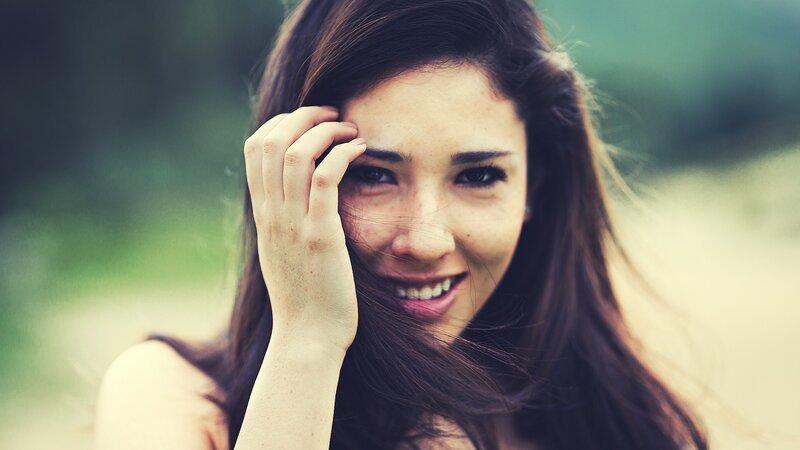 woman smiling outdoors