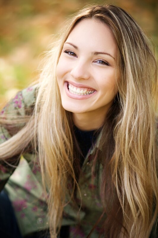 woman smiling outdoors