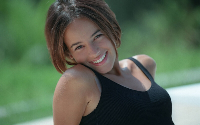 woman smiling outdoors