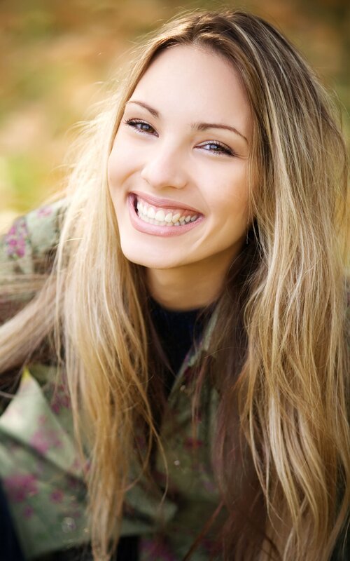 woman smiling outdoors