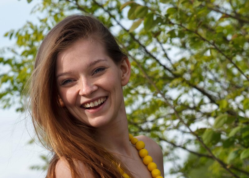 woman smiling outdoors