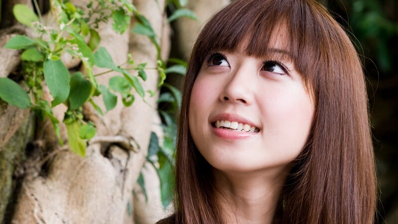 woman smiling outdoors