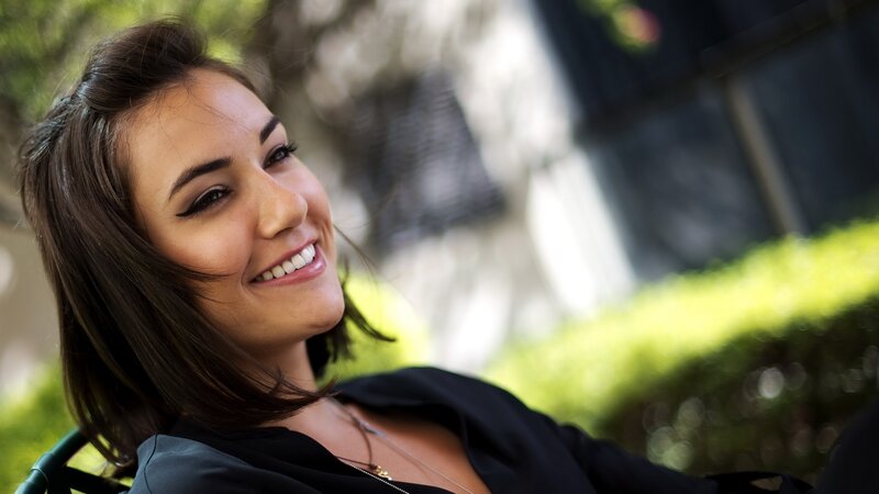 woman smiling outdoors