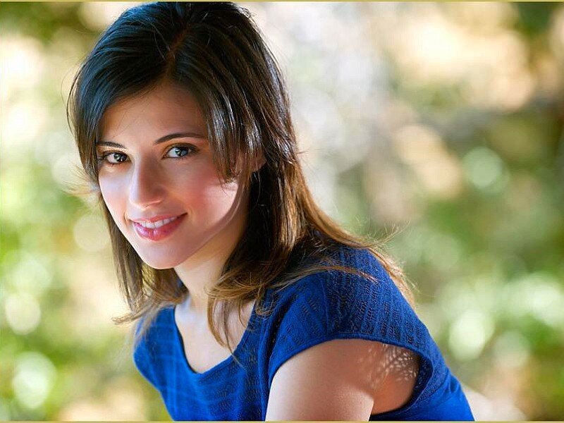 woman smiling outdoors