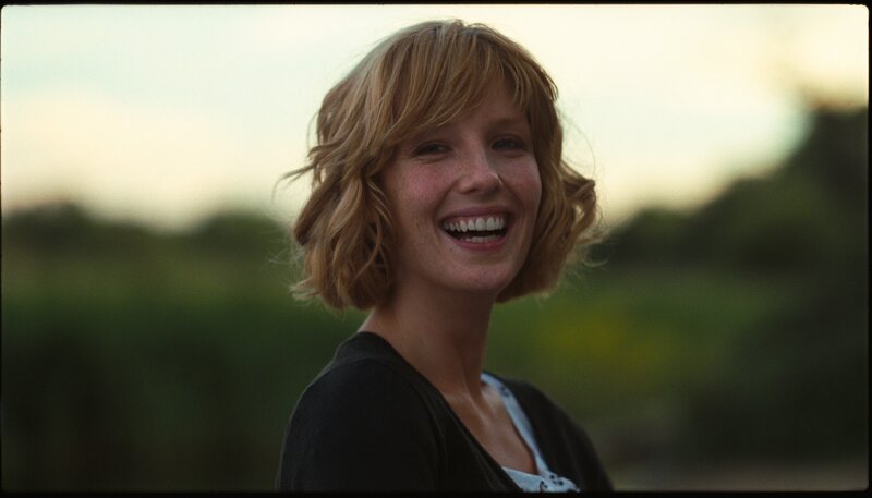 woman smiling outdoors
