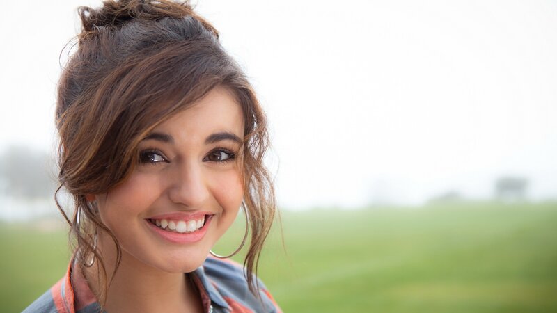 woman smiling outdoors