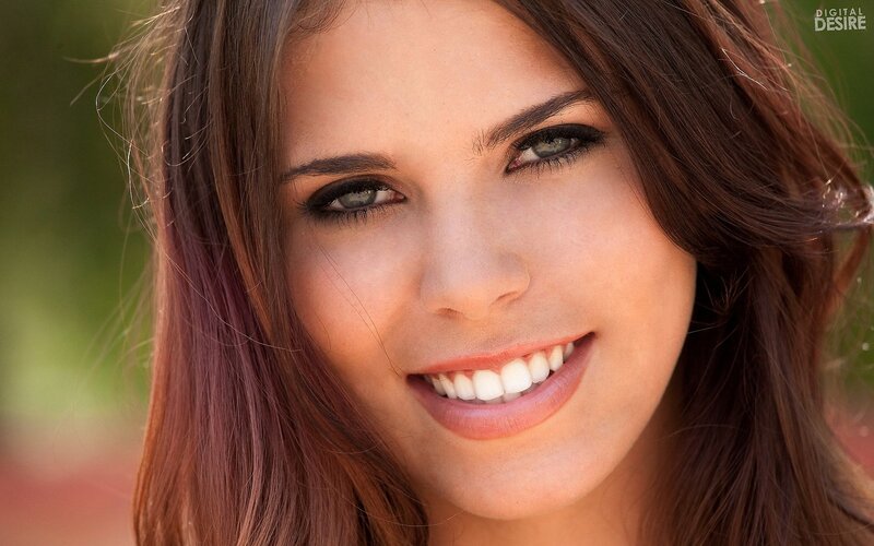 woman smiling outdoors