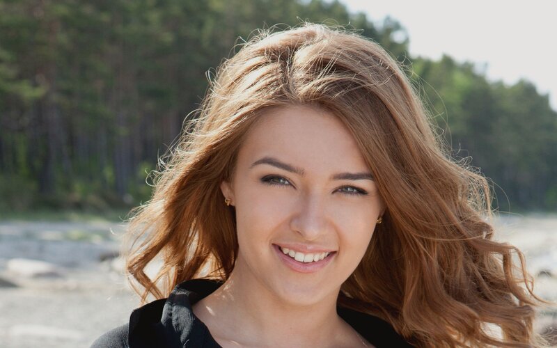 woman smiling outdoors