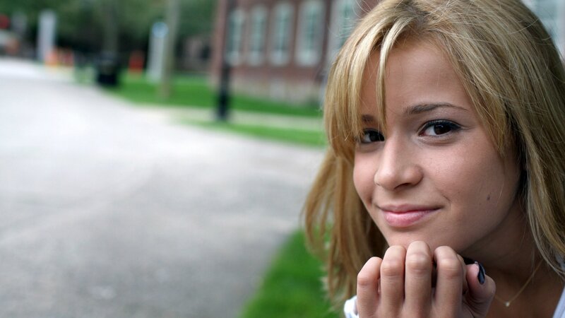 woman smiling outdoors