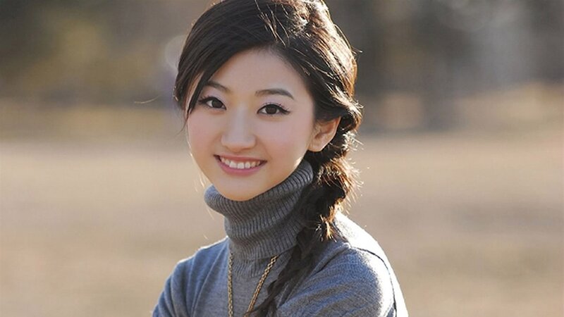 woman smiling outdoors