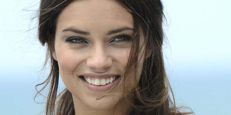 Woman Smiling Outdoors — Blue