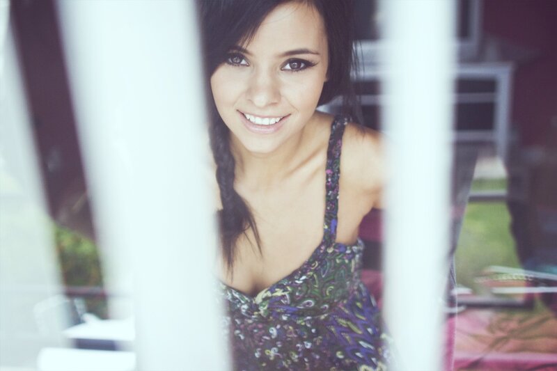 woman smiling through window