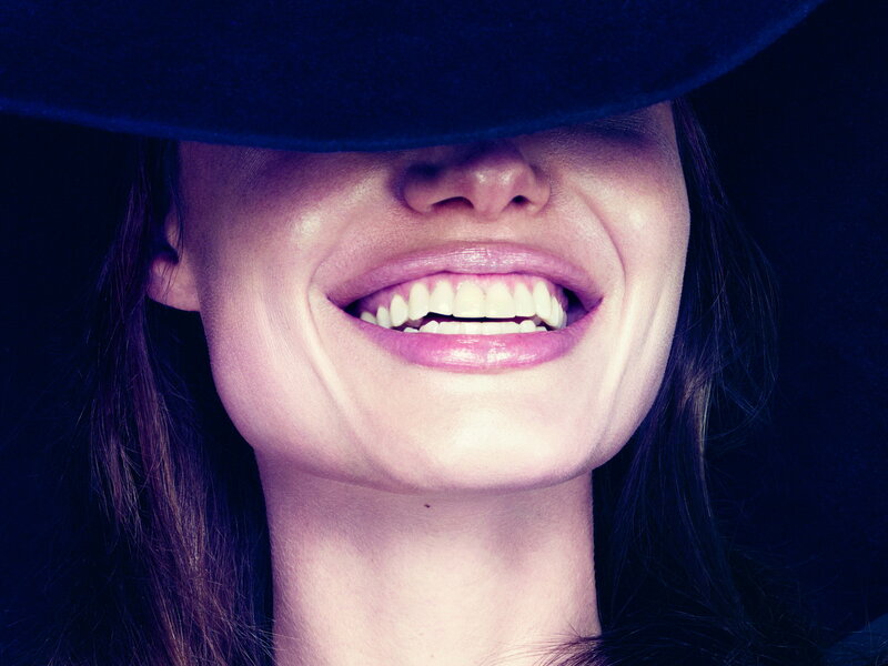 Woman Smiling under Hat