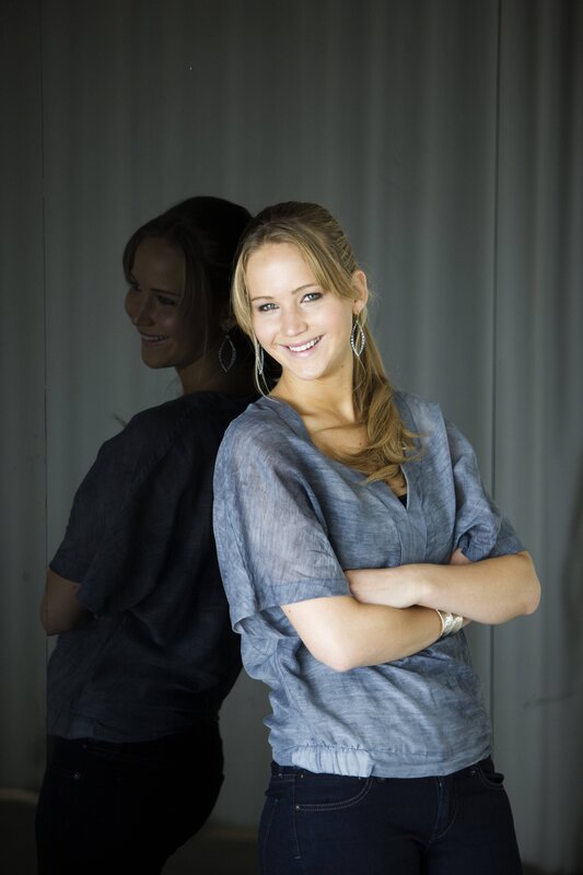 woman smiling with arms crossed