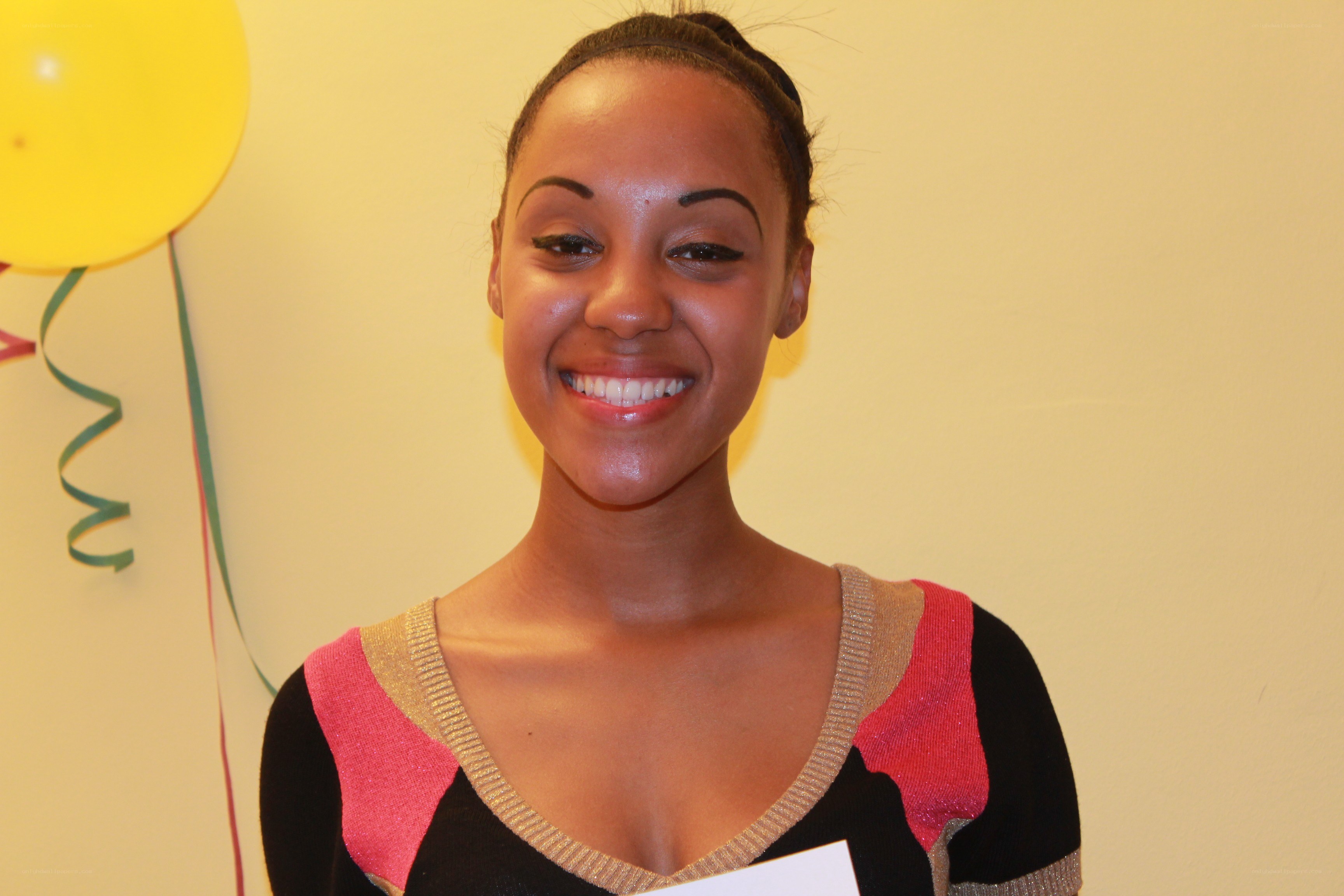 woman smiling with balloon