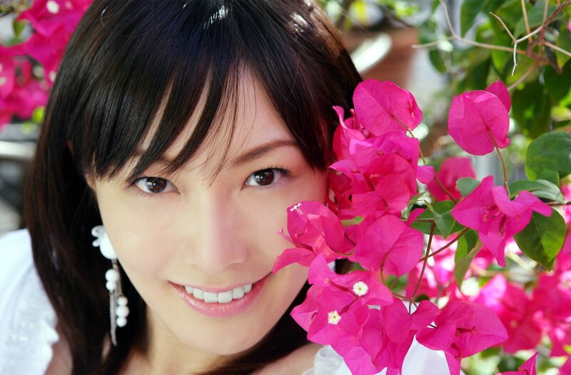 woman smiling with bougainvillea