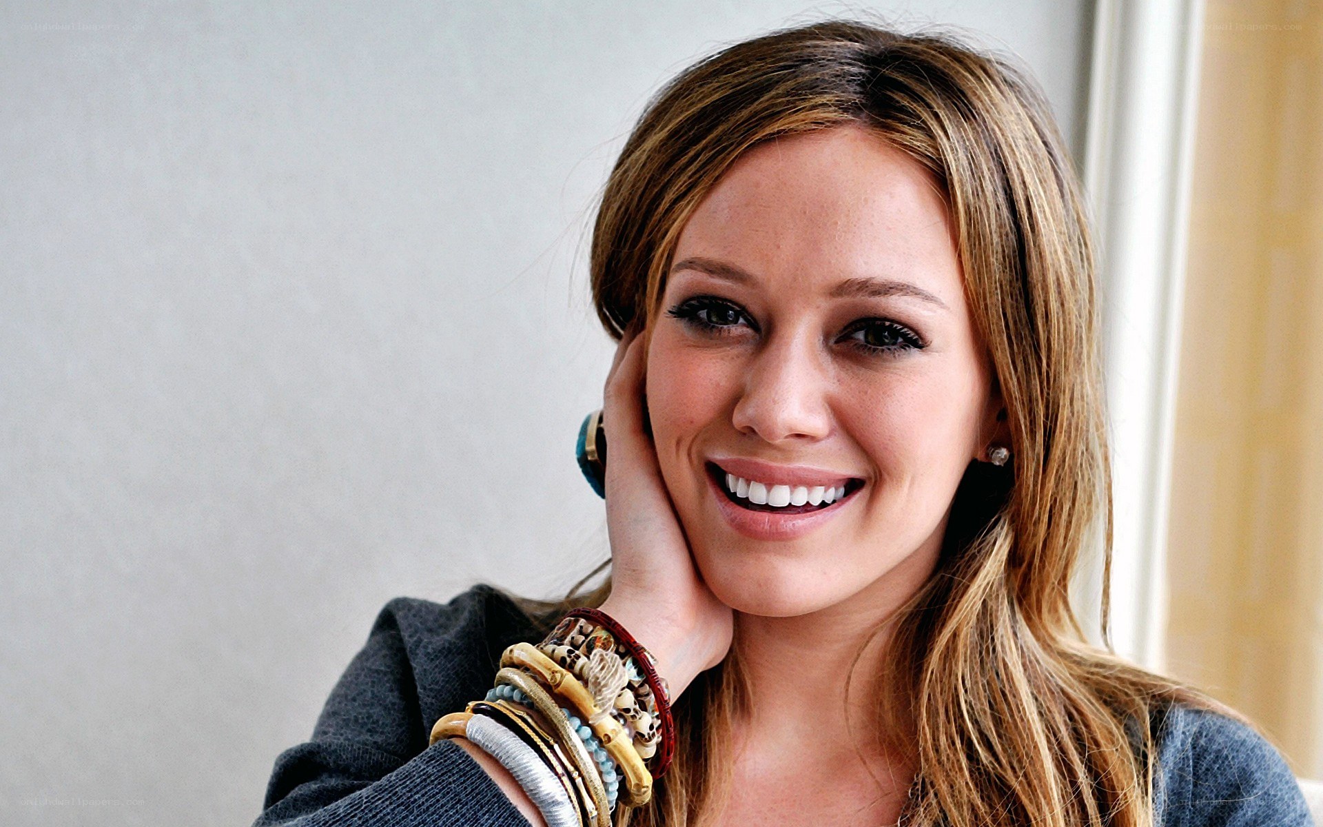 woman smiling with bracelets