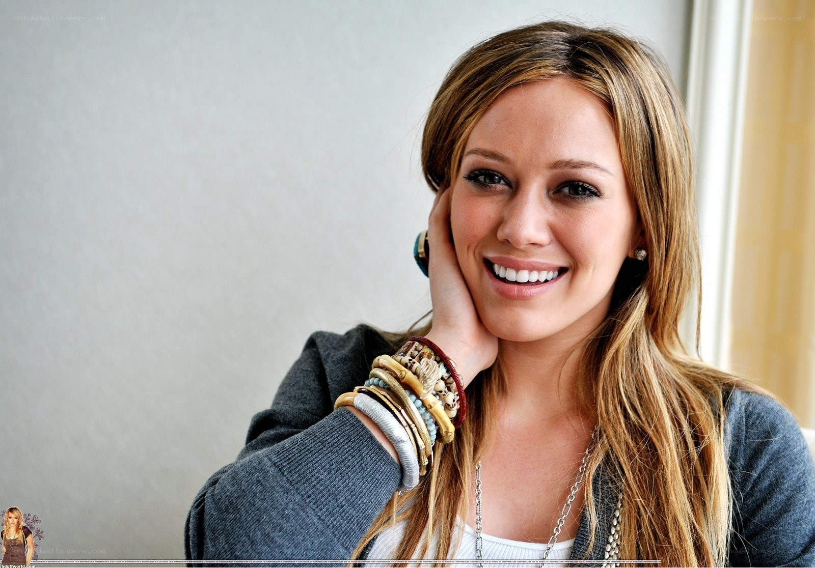 woman smiling with bracelets