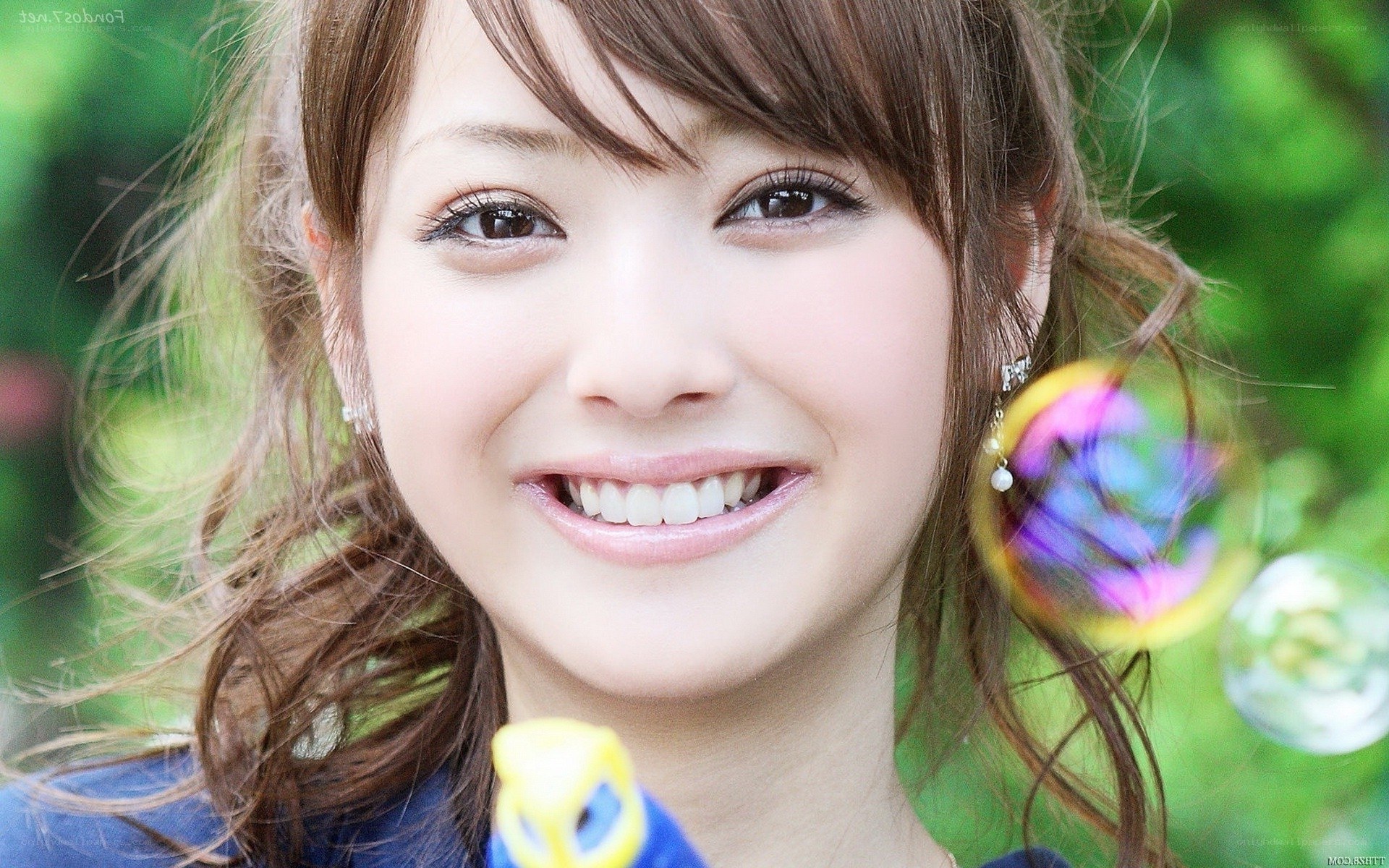 woman smiling with bubbles