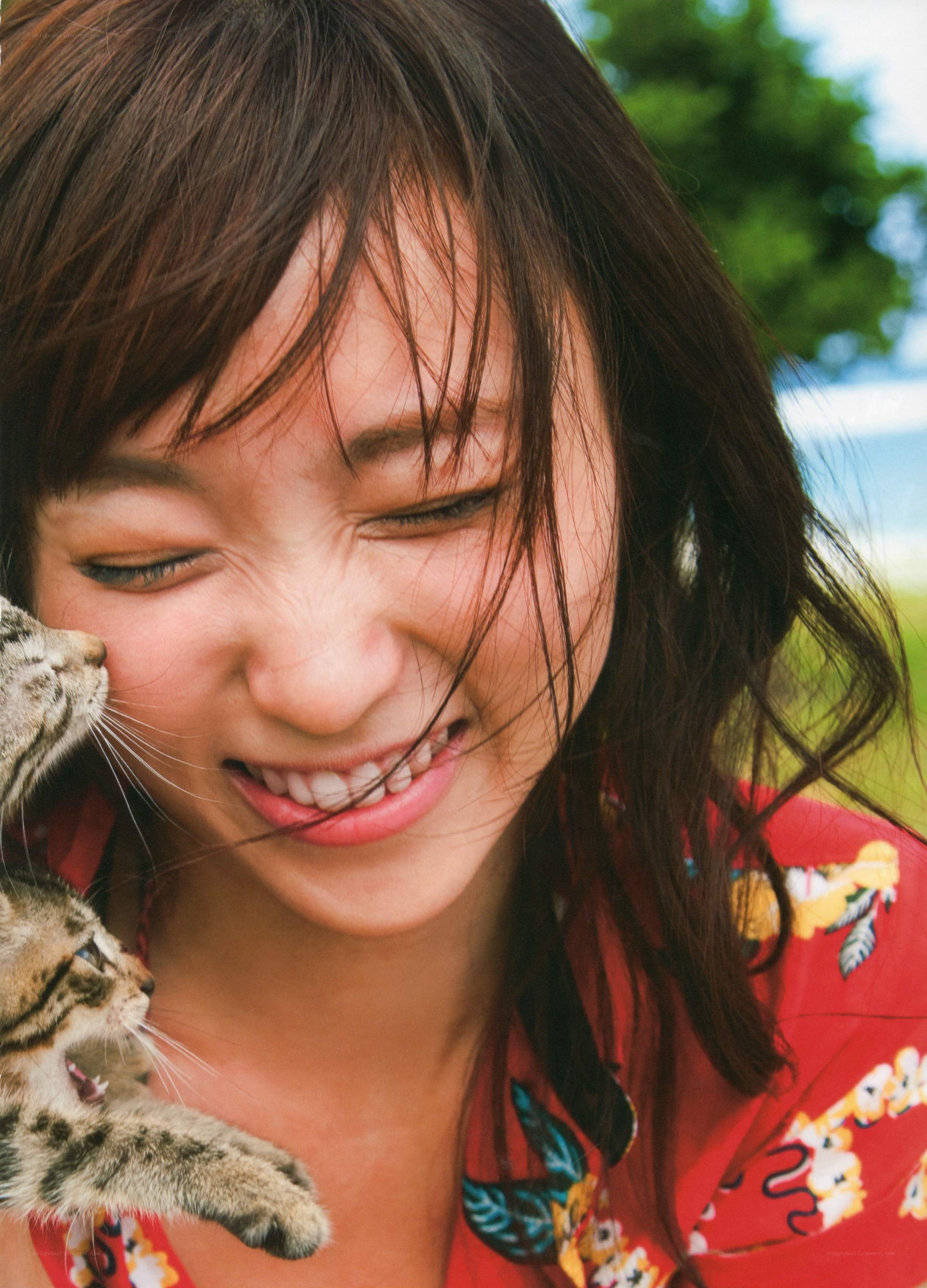 Woman smiling with cats