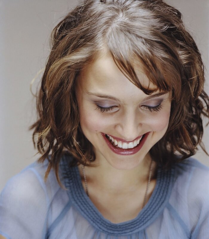 woman smiling with closed eyes