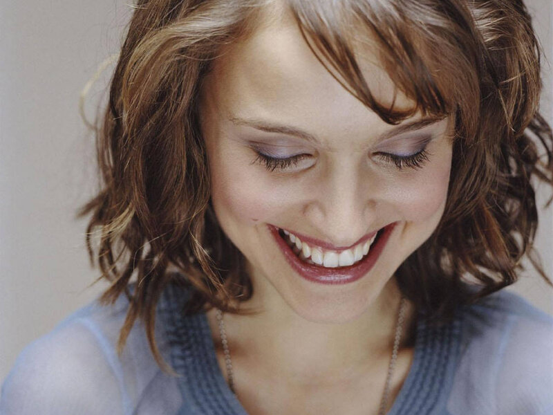woman smiling with closed eyes